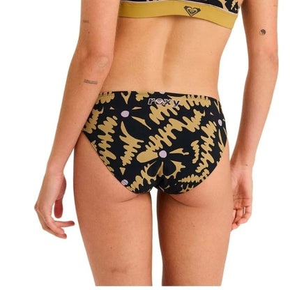 Woman wearing a black and gold bikini with a brand logo on a white background