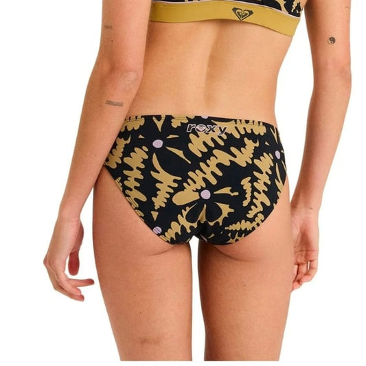 Woman wearing a black and gold bikini with a brand logo on a white background