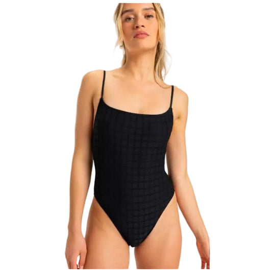 Woman wearing a black textured swimsuit against a white background