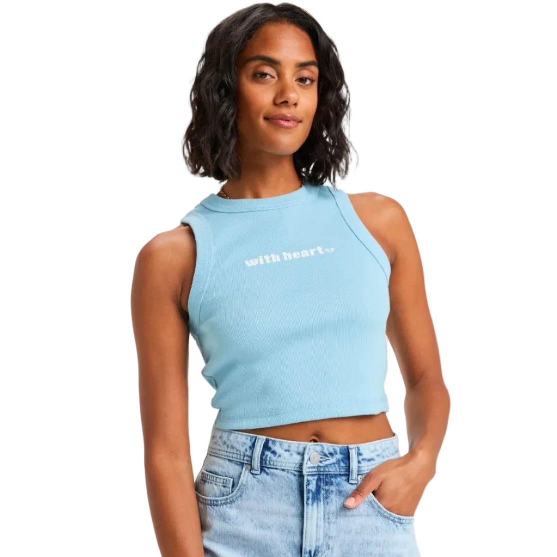 Woman wearing a light blue crop top with 'with heart' text on a plain background