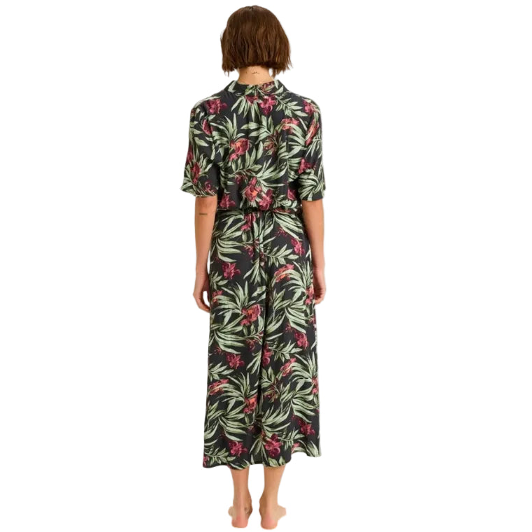 Woman wearing a floral dress with a white background