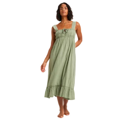 Woman wearing a green dress on a white background