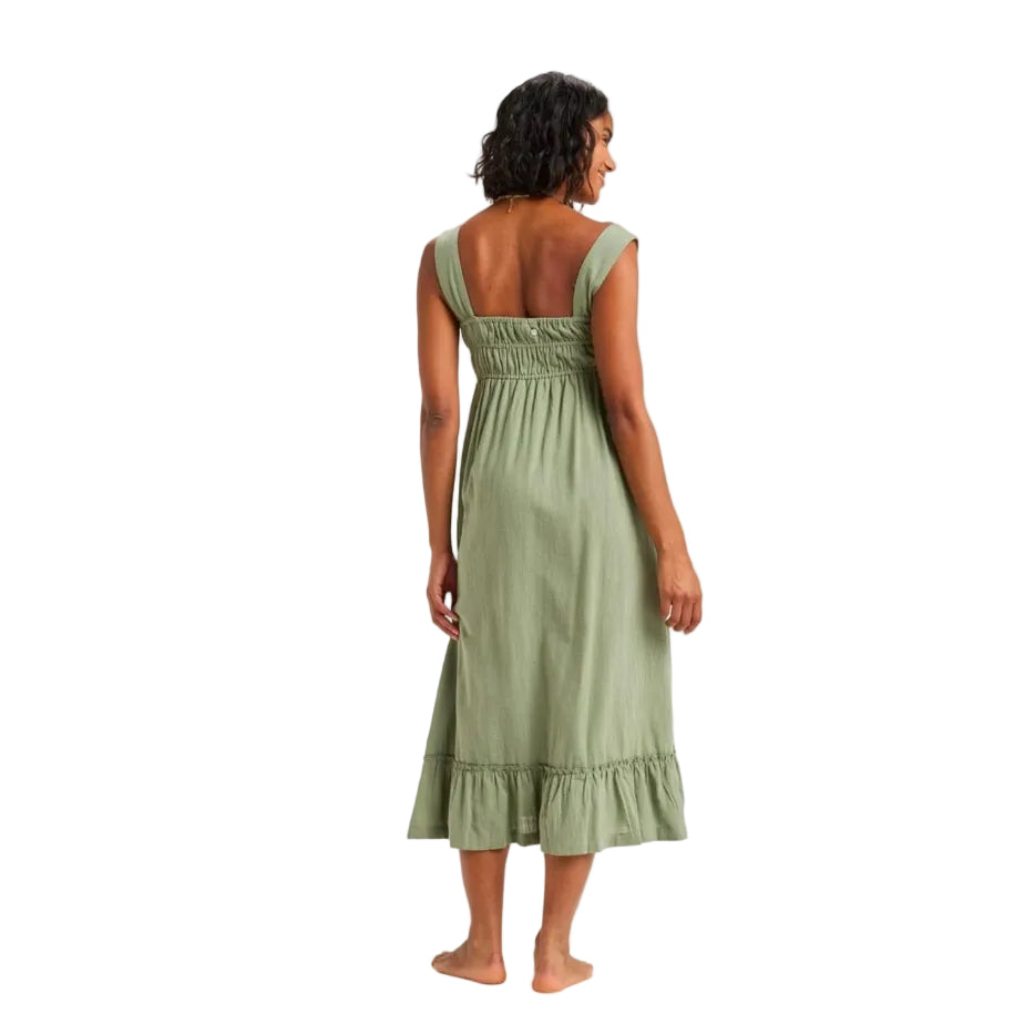 Woman wearing a green dress on a white background