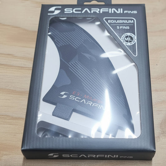 Scarfini fins packaging on a wooden surface