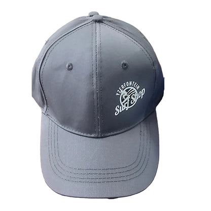 Gray cap with a logo on a wooden surface