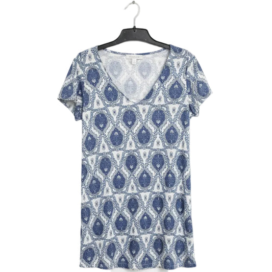 Blue and white patterned dress on a hanger against a white background