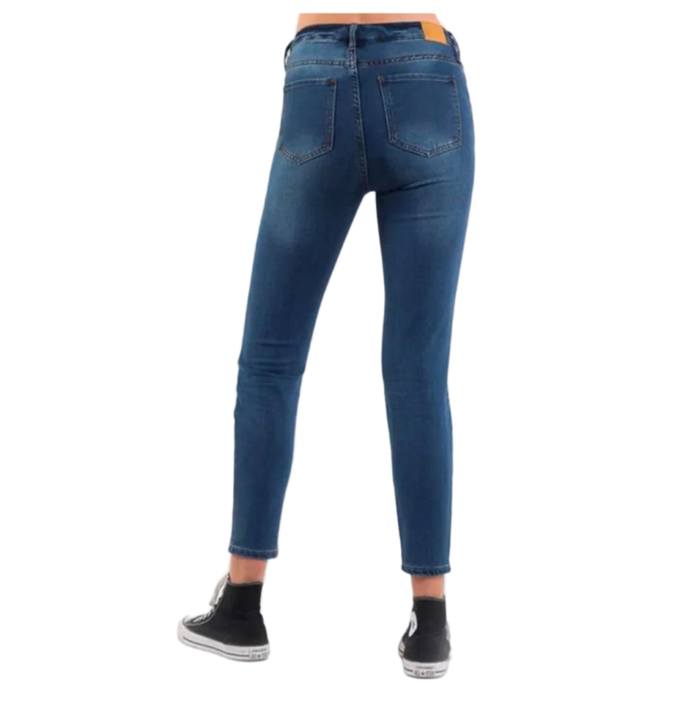 Blue jeans worn by a person on a white background