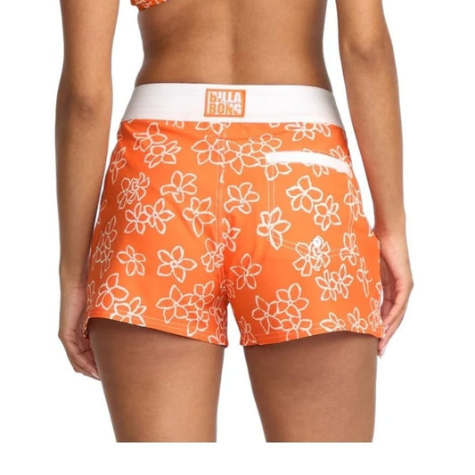 Orange floral-patterned shorts worn by a person on a white background