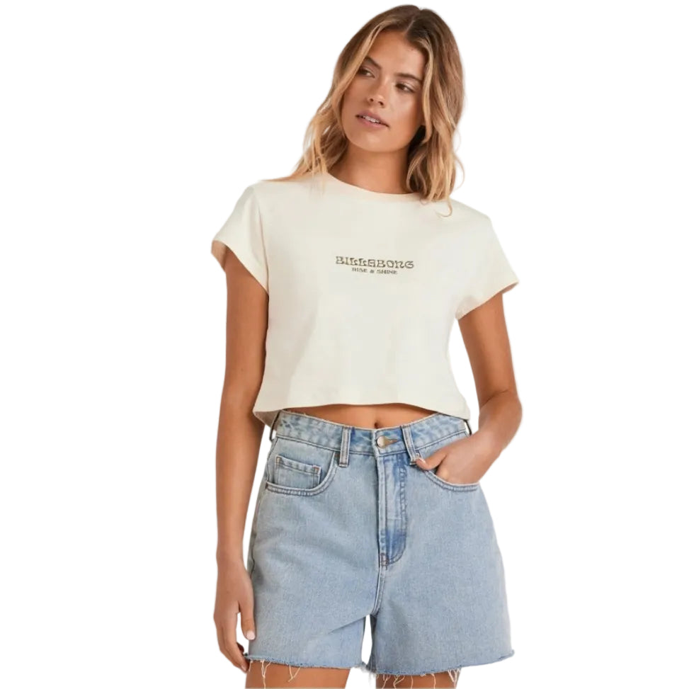 Woman wearing a white t-shirt with text and denim shorts on a white background