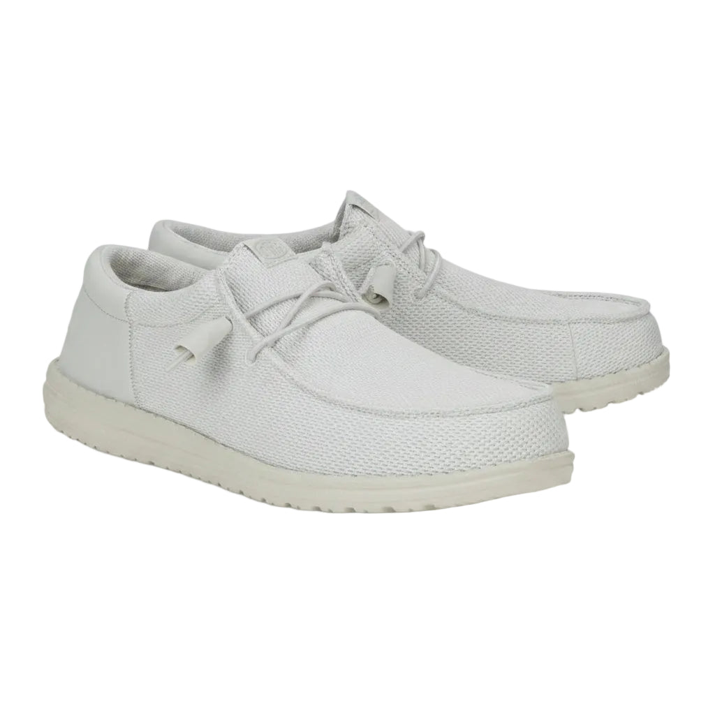 Pair of light gray sneakers on a white background