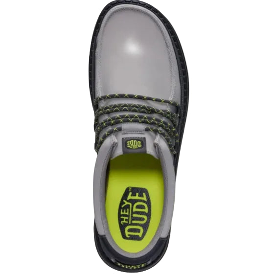Gray shoe with green sole and 'Hey Dude' branding on a white background