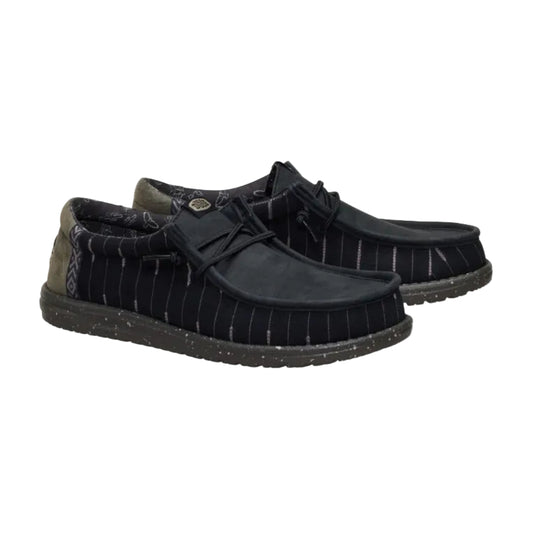 Black pinstripe shoes on a white background