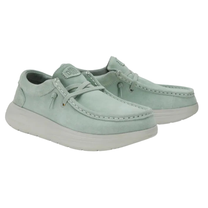 Pair of light green casual shoes on a white background