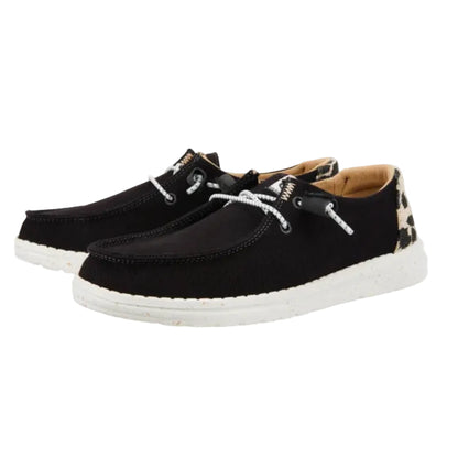 Black casual shoes with white soles on a white background