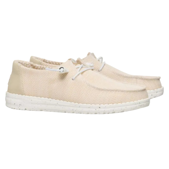 Beige sneakers with white laces on a white background