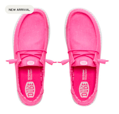 Pink slip-on shoes with 'The Dude' branding on a white background