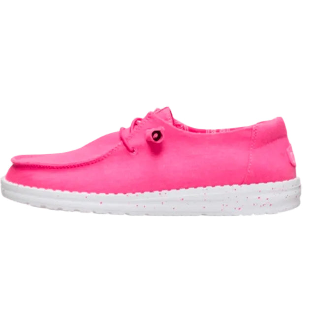 Pink slip-on shoe with a white sole on a white background