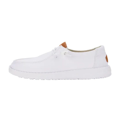 White sneaker with brown accents on a white background