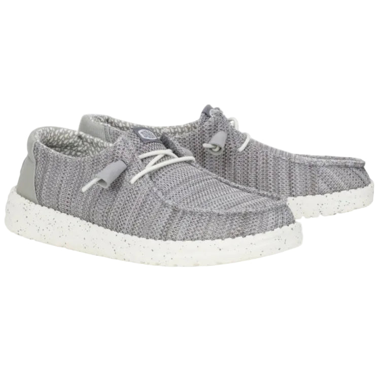 Gray sneakers with white soles on a white background