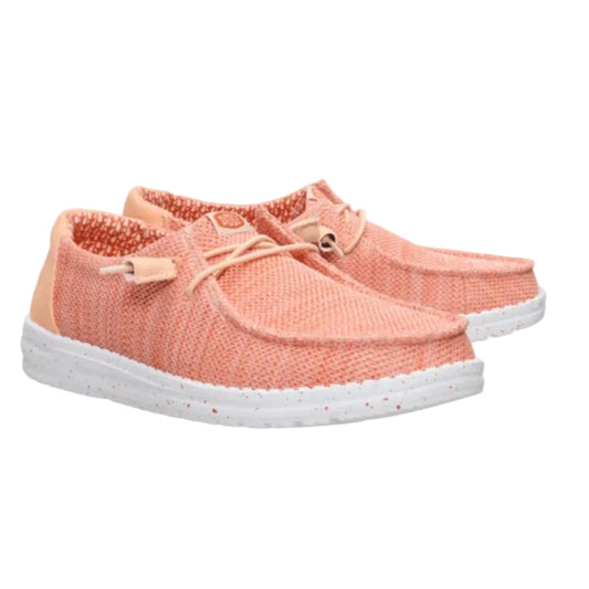 Pair of pink sneakers with white soles on a white background