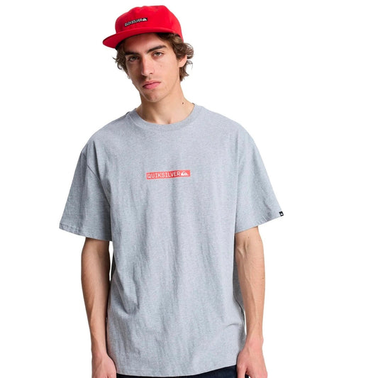 Person wearing a gray t-shirt with a red logo and a red cap on a white background