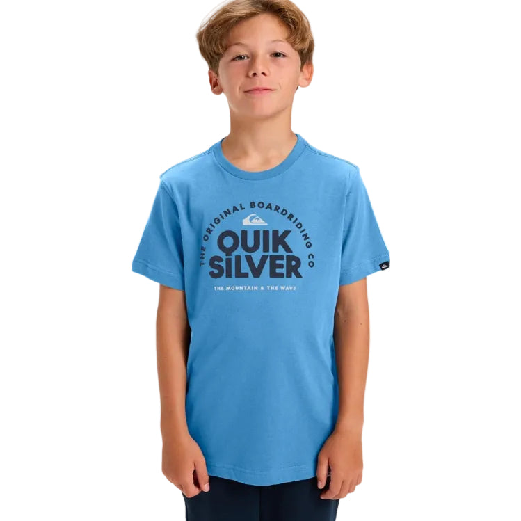 Child wearing a blue Quiksilver t-shirt on a white background