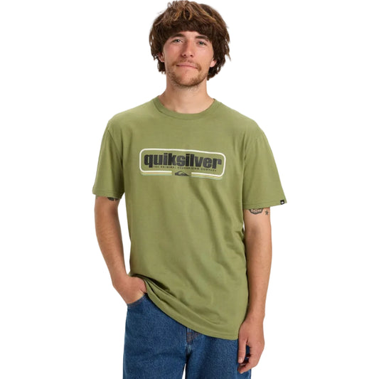 Person wearing a green Quiksilver t-shirt on a white background