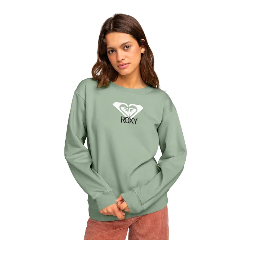 Woman wearing a green Roxy sweatshirt on a white background