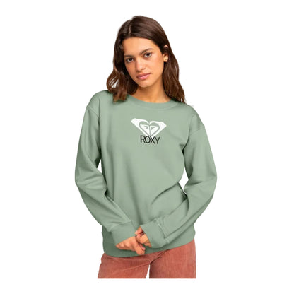 Woman wearing a green Roxy sweatshirt on a white background