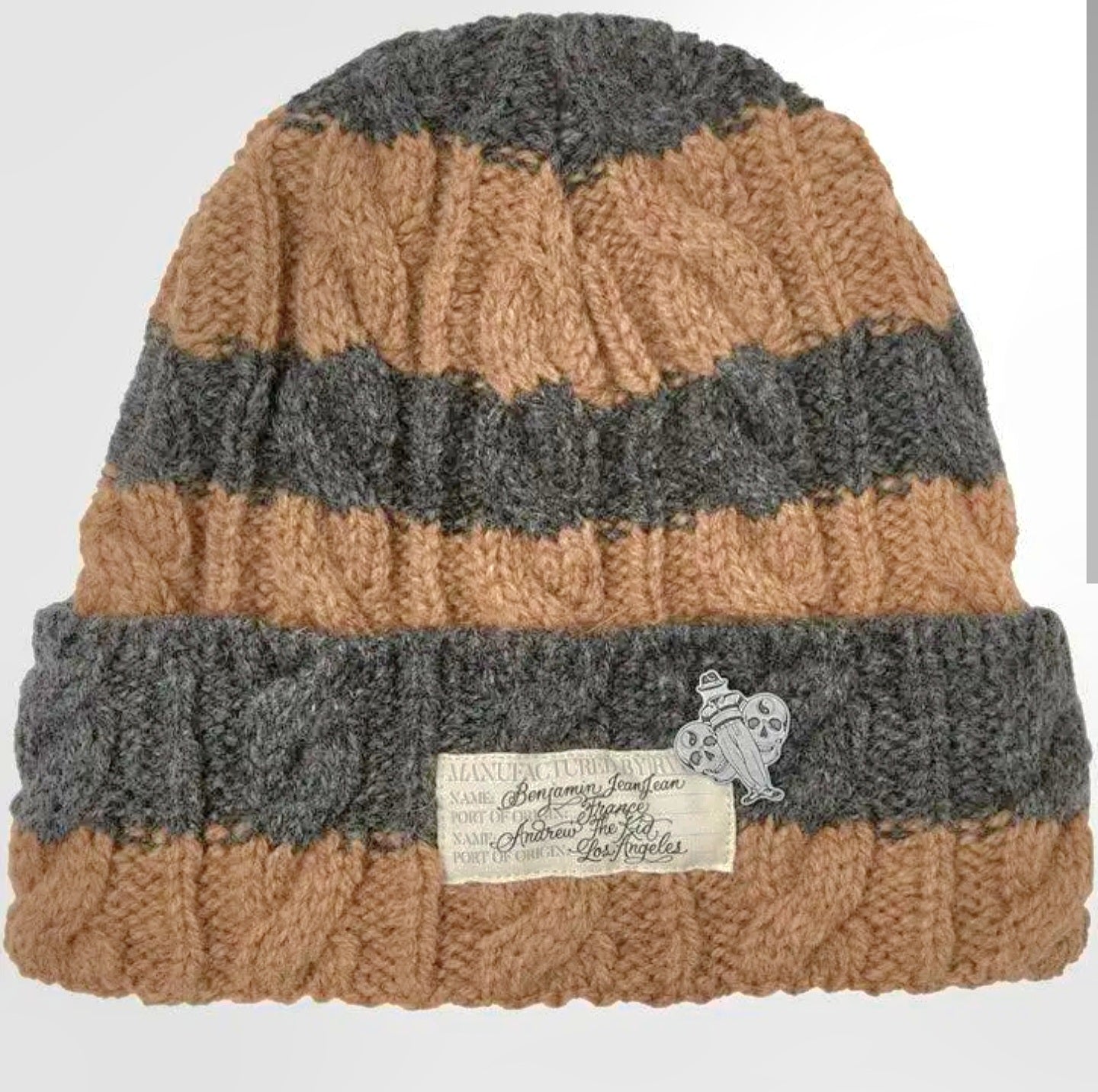 Knitted beanie with brown and gray stripes on a white background