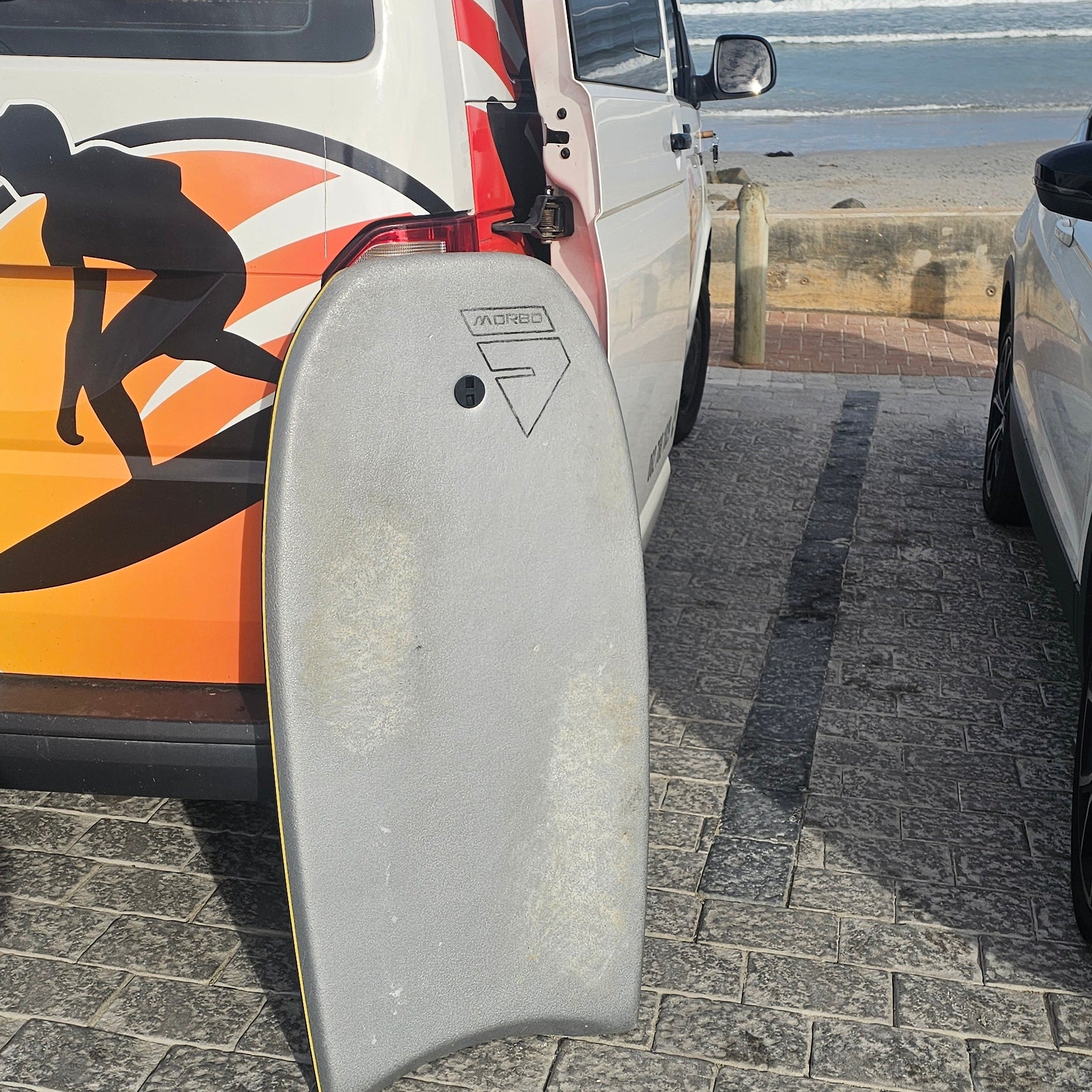 Close-up of a vehicle with a distinctive design on a textured wall background