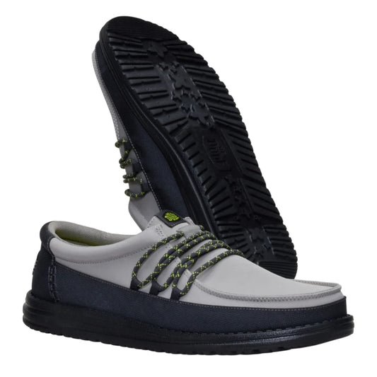 Gray and black shoe with textured sole on a white background
