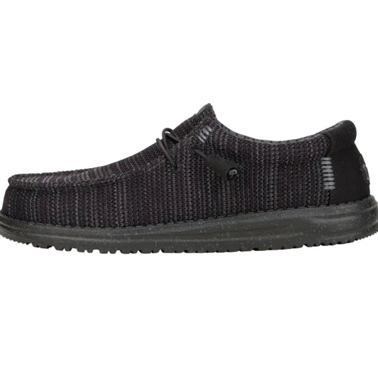 Black knit shoe on a white background